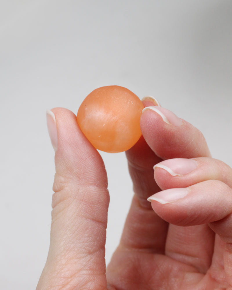 Selenite tumbled pocket stone orange