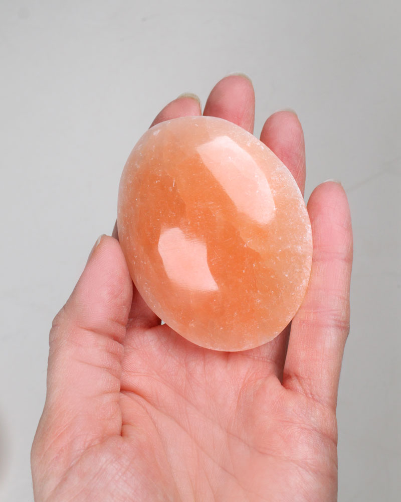 Selenite Palm stone orange 6 cm